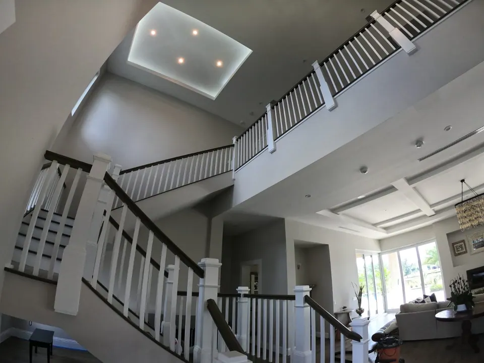 Two-story foyer and staircase after painting