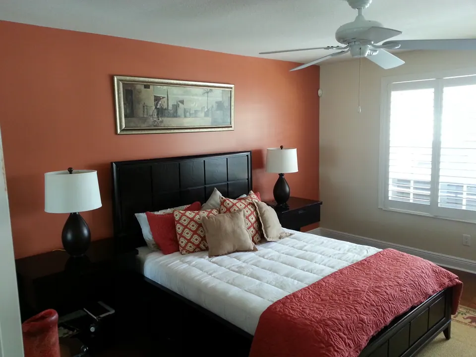 Bedroom with a coral accent wall
