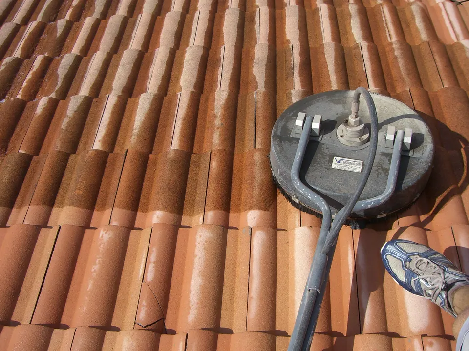 Pressure cleaning a clay tile roof