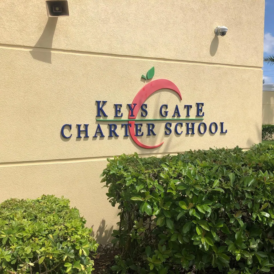 Keys Gate Charter School sign on a freshly painted wall